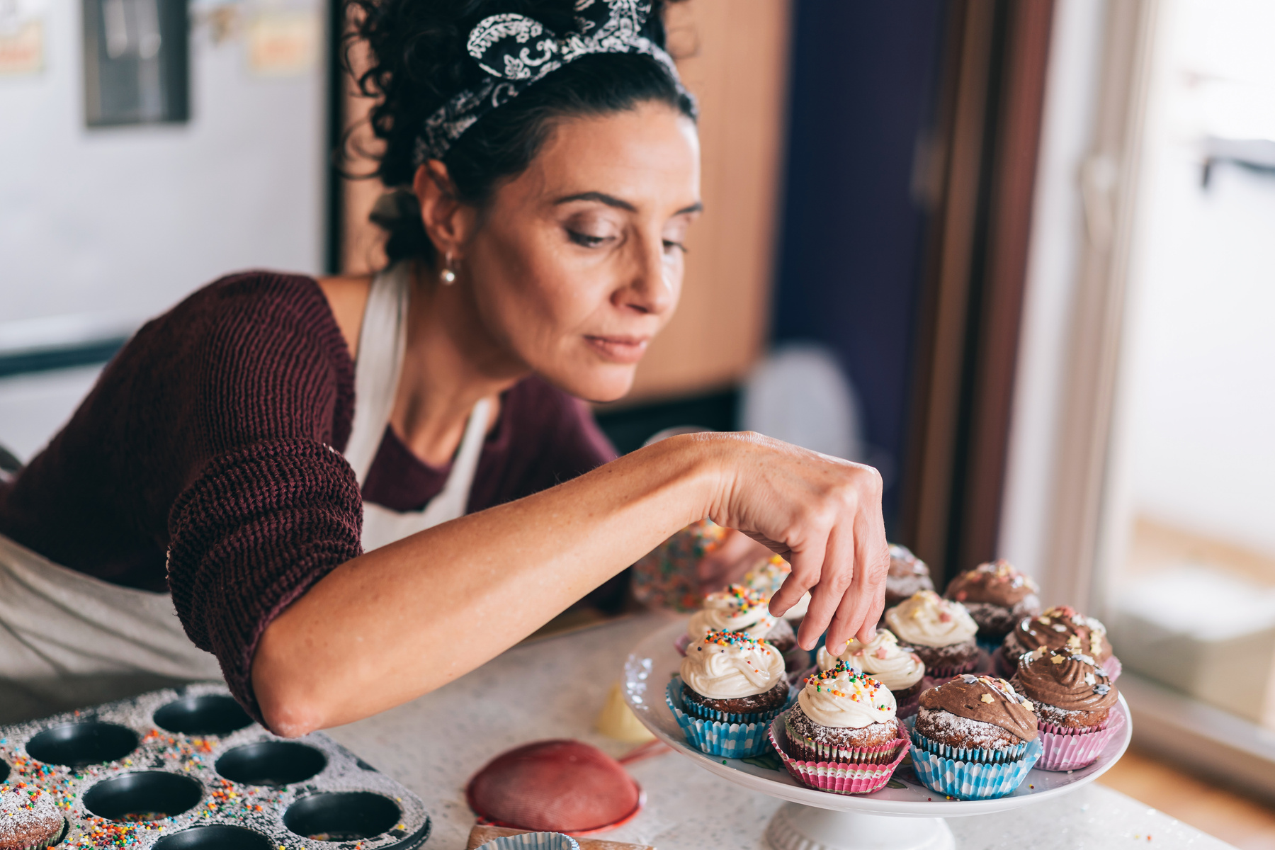 Confectioner decorating Chocolate Muffins